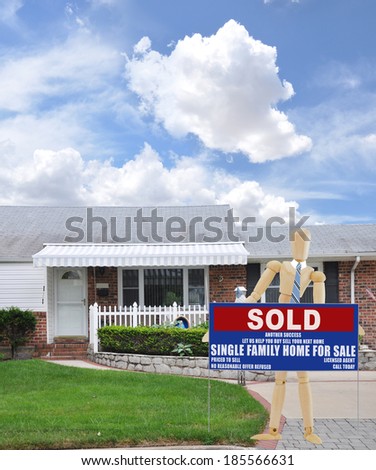 Mannequin wearing blue tie holding Real Estate Sold (Another success let us help you buy sell your next home) Suburban Brick Ranch style home Residential Neighborhood USA Blue Sky Clouds