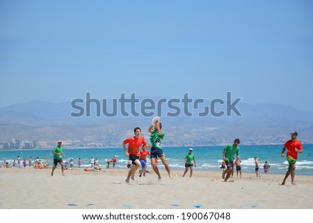 ALICANTE, SPAIN - APR 27: Seville\'s Frisbillanes Frisbee team member catching frisbee during game in the 1st Ultimate Frisbee Tournament held Apr 26-27 at San Juan Beach in Alicante April 27, 2014.