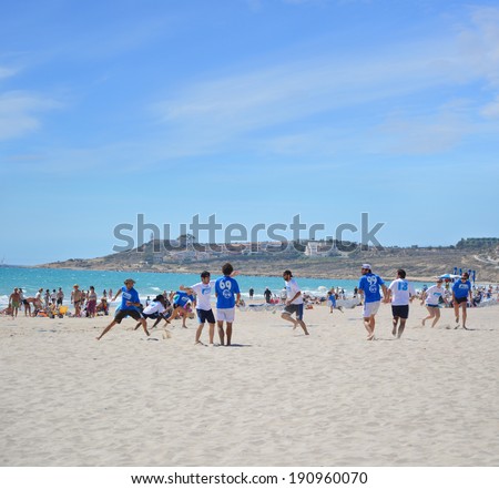 ALICANTE, SPAIN - APR 27: Alicante's frisbee team Barbaras wearing blue are competing in the First Ultimate Frisbee Tournament held at San Juan Beach in Alicante, April 27, 2014.