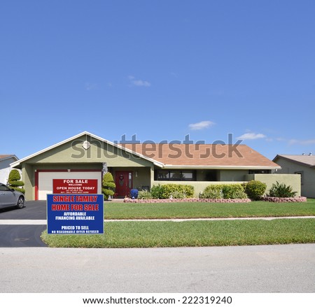 Real Estate for sale open house welcome sign front yard lawn of suburban ranch style home residential neighborhood blue sky USA