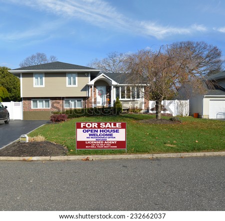 Real Estate For Sale Open House Welcome sign curb of suburban high ranch home autumn day residential neighborhood blue sky clouds USA