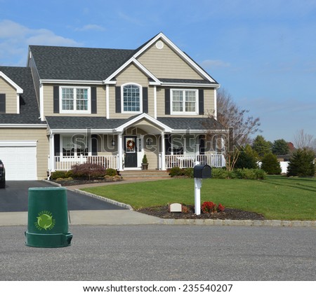 Recycle trash container Suburban Mcmansion home residential neighborhood USA