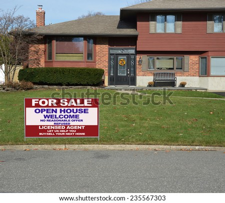 Real Estate for sale open house welcome sign  on front yard lawn of Suburban high ranch house residential neighborhood USA