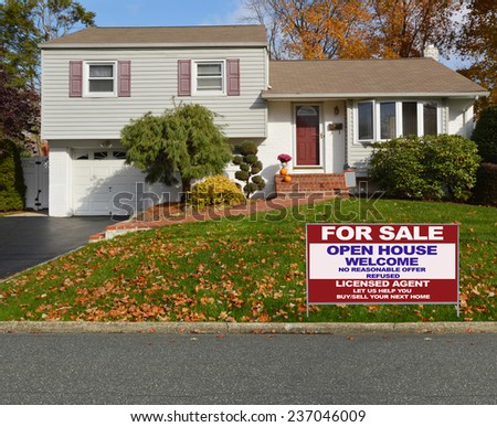 Real Estate for sale open house welcome sign Suburban high ranch house autumn day residential neighborhood USA