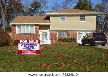 Real estate for sale open house welcome sign Suburban Brick High Ranch autumn day blue sky residential neighborhood USA