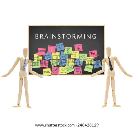Two Mannequins wearing ties showing Brainstorming Ideas on post it notes on blackboard isolated on white background