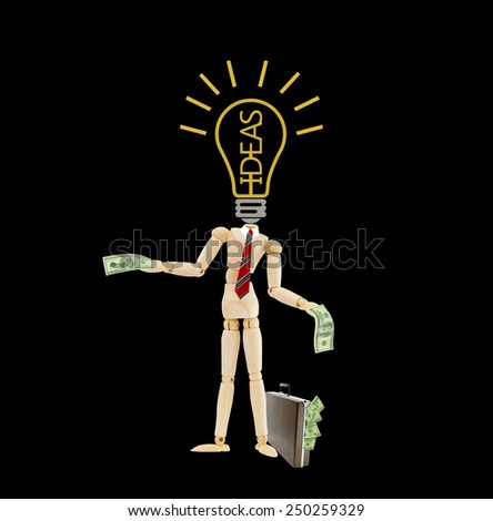 Idea light bulb headless mannequin wearing red striped tie holding one hundred dollar bill standing next to brown briefcase attache case isolated on black