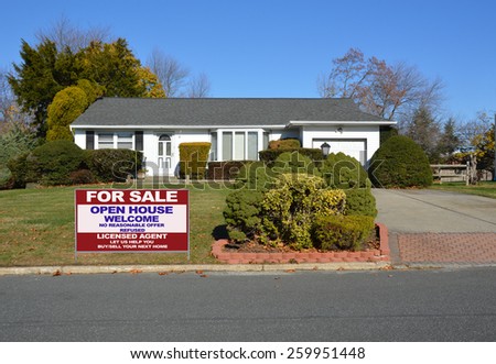 Real estate for sale open house welcome sign Suburban Ranch style home clear blue sky residential neighborhood USA