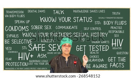 Teacher wearing Tested button pointing to Safe Sex Chalkboard: Get Tested, Know Your Status, Get Facts, Protection, Question, Responsible Sex, Truth, Be Aware, Unsure Say No, Sober Sex