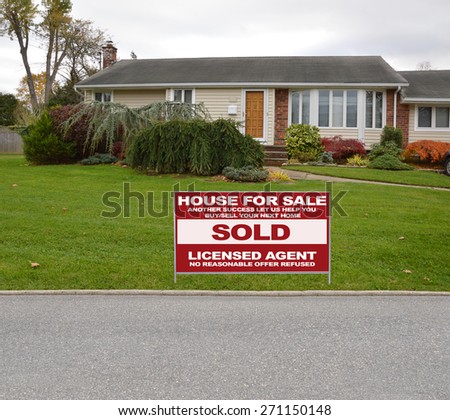 Real estate sold (another success let us help you buy sell your next home) sign Suburban Ranch Home Landscaped Residential neighborhood USA Overcast Sky