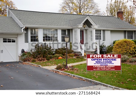 Real estate for sale open house welcome sign Beautiful Gray Ranch home Bay Window Autumn Overcast Day Residential neighborhood USA