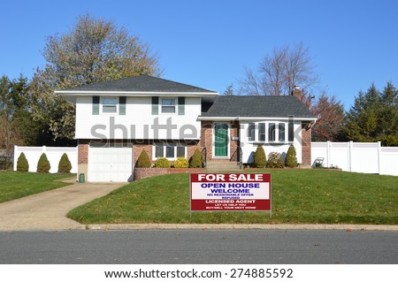Real estate for sale open house welcome sign Suburban Ranch home sunny clear blue sky residential neighborhood USA