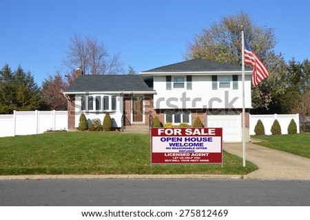 Real estate for sale open house welcome sign Suburban Brick Brownstone Home Autumn blue sky day residential neighborhood USA