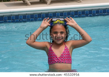Family Vacation African American biracial beautiful girl in pool