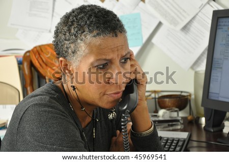 African American Professional Woman Listening on Phone Serious Facial Expression