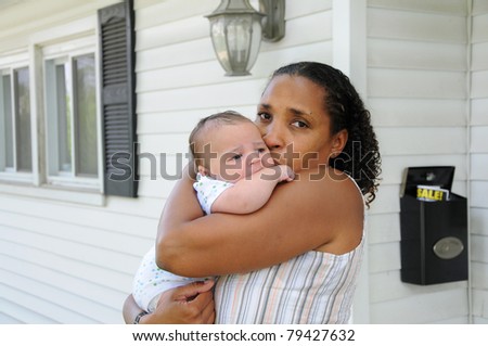 Two Generation Family Newborn Infant Baby Hugging Grandmother Outside Home