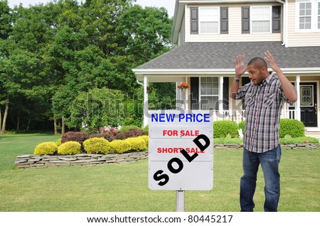 Happy Surprised Handsome Young Man Looking at Real Estate Sold House Sign