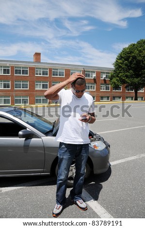 Bad Day Lost Young Man Car Trouble Hand on Head Looking at Cell Phone