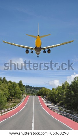 Airplane Flying Away above Two Lane Highway in Europe