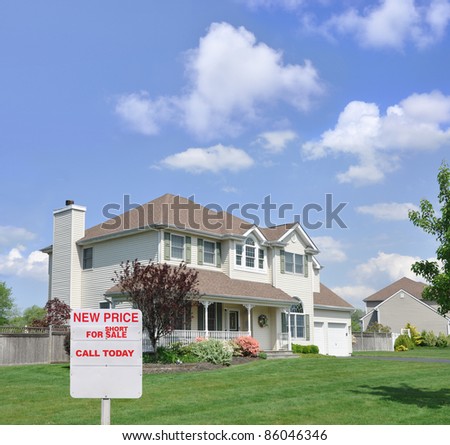 Short Sale For Sale Realtors Sign in Front of Beautiful Two Story Suburban Residential District Home Blue Cloud Sky Sunny Day