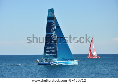 ALICANTE, SPAIN - OCT 25: Team Telefonica sailboat sailing near Camper and New Zealand\'s Team sailboat during 2011-2012 Volvo Ocean Race exhibition in the Mediterranean Sea in Alicante. Oct 25, 2011.