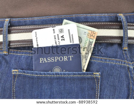 American Passport Airline Boarding Pass Twenty Dollar Bill in Denim Blue Jean Pants Pocket of International Traveler
