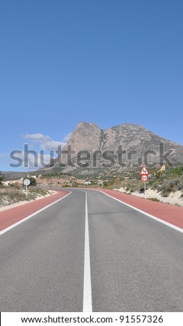Two Lane Highway leading to Puig Campana (Bell Peak) Mountain in Finestrat a small town in the community of Valencia and the province of costa blanca Alicante Spain Europe