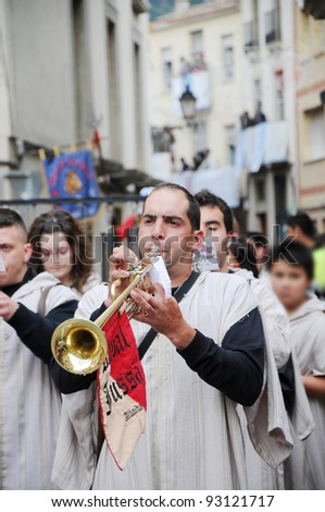 MURO ALCOY, SPAIN - MAY 7: Marching band musician playing and marching in Moors and Christians parade that commemorates the 8th century battles and struggles in Spain. Muro Alcoy May 7, 2011.