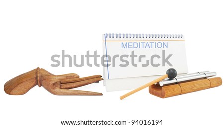 Meditation Buddha Hand with Chime and Notepad isolated on white background