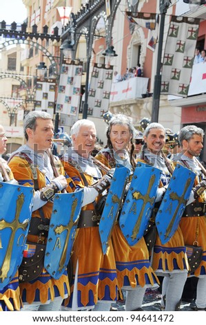 ALCOY, SPAIN - MAY 14: Men dressed as Christian legion marching in annual Moros y Cristianos parade commemorating Reconquista battles between Moors and Christians in Spain. Alcoy May 14, 2011