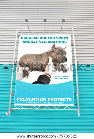 Animal Health Care Prevention Protects Billboard Advertisement Message with Purebred Blue Nose American Bully six week old puppy dog