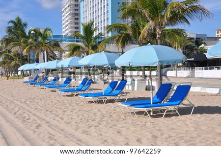 Early Morning View of Lounge Chairs Umbrellas on sandy beach in Fort Lauderdale Florida