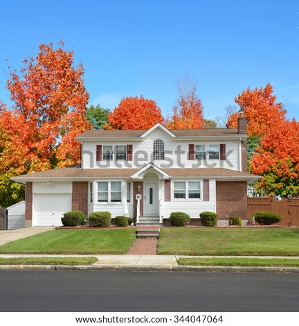 Beautiful Suburban Home residential neighborhood Autumn Season Day Blue Sky
