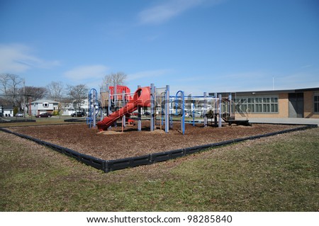 Outdoor Playground in Suburban Neighborhood landscaped with wood chips