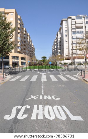 School Crossing Traffic sign Pedestrian Crosswalk on street of Urban City Highrise Residential area