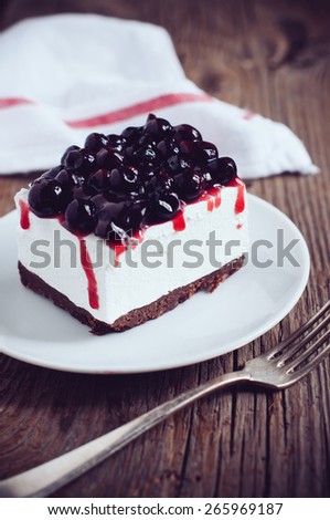 Fresh tasty cheesecake with blackberry on a plate, creamy dessert
