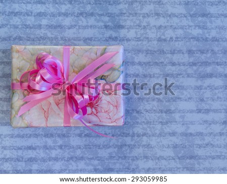 Feminine Wrapped Gift on Lilac Background
