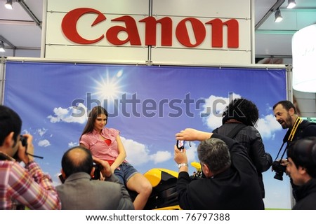 ISTANBUL, TURKEY - APRIL 14: Model on the stage on April 14,2011 in Photo exhibition show Istanbul, Turkey. 4th Trade fair for photography, digital imaging, albums, printing & technologies equipments