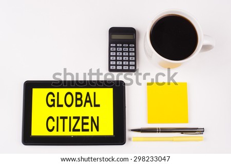 Business Term / Business Phrase on Tablet PC with a cup of coffee, Pens, Calculator, and yellow note pad on a White Background - Black Word(s) on a yellow background - Global Citizen