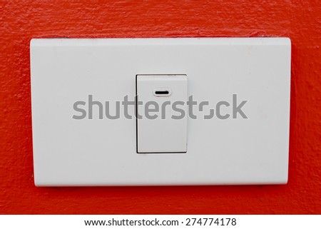 Wall switch on the red wall