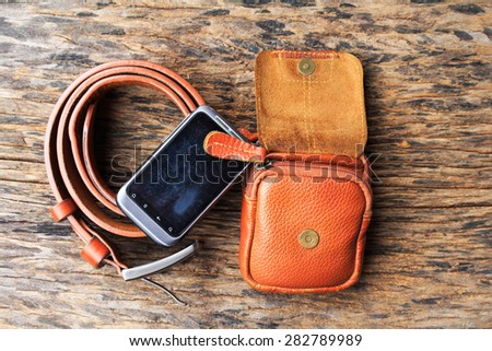 Bag and  belt  on wood