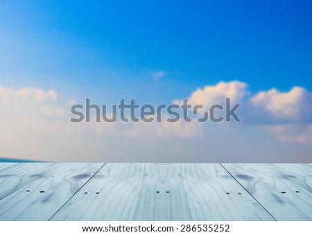 Empty table on sky background.