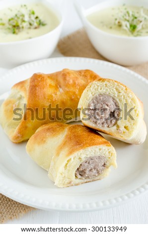 Yeast dough croissant stuffed with sausage (Polish Easter food)