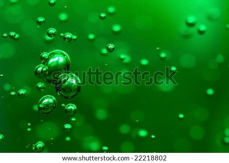 green bubbles suspended in Aloe Vera gel
