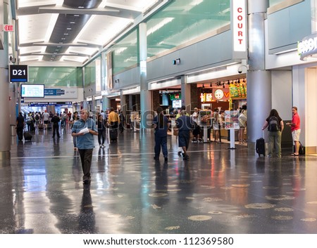 MIAMI, FLORIDA - CIRCA AUGUST 2012:  New American Airlines terminal of the Miami Intl. Airport, circa august 2012. 38 million passengers travel through the airport annually.