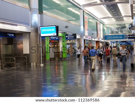 MIAMI, FLORIDA - CIRCA AUGUST 2012:  New American Airlines terminal of the Miami Intl. Airport, circa august 2012. 38 million passengers travel through the airport annually.