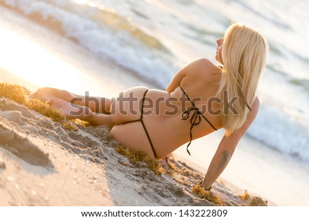 Rear view shot of hot woman in two piece bikini