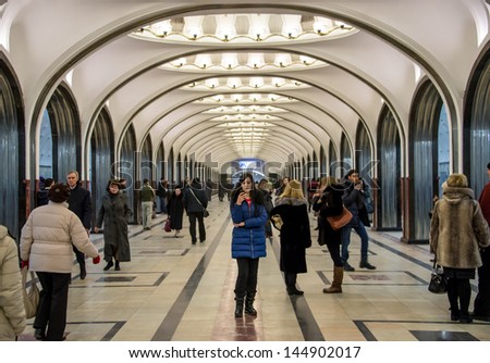 MOSCOW - CIRCA MARCH 2013: People in the famous Mayakovskaya Metro Station circa March 2013. With a population of more than 11 million people is one the largest cities in the world.