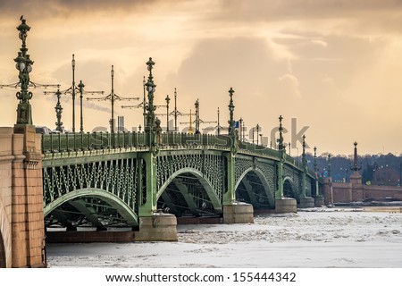 View Of The Trinity Bridge In St. Petersburg Over The Frozen Neva River In During The Afternoon.