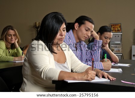 A group of workers during a training class in the office.